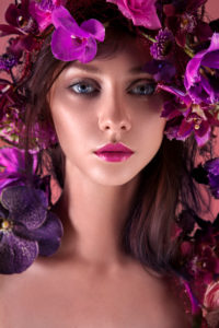 beauty close-up, detail, head-on with wreath of orchids, pink lips beauty close-up, detail, head-on with wreath of orchids, pink lips